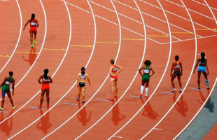 Female athletes on running track 