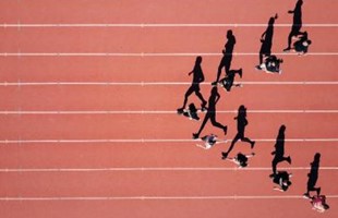 Birds-eye views of athlete running on track, featuring their silhouettes aligned across the ground. 